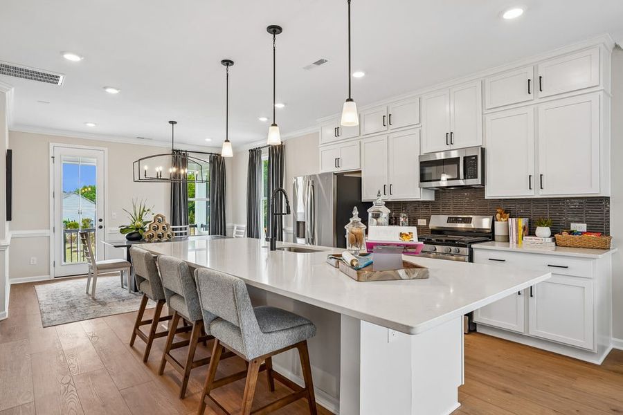 Furnished interior in a model home at South Lake Townes at Flowers Plantation in Clayton (Image 9).