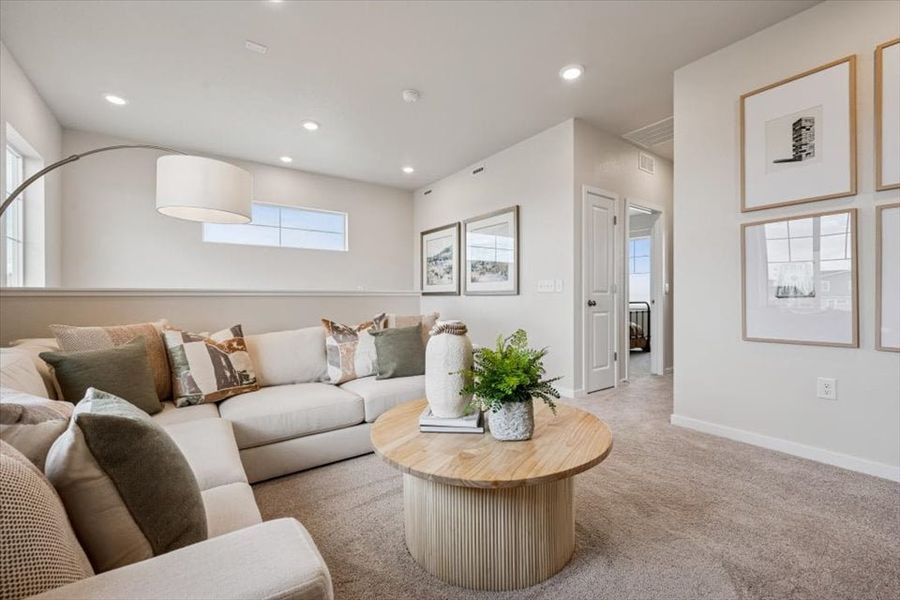 A living room with a couch and a coffee table. A living room with a couch and a coffee table.