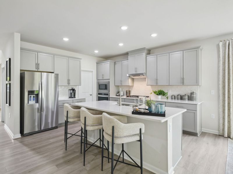 The spacious kitchen features a walk-in pantry, fit for a home chef.