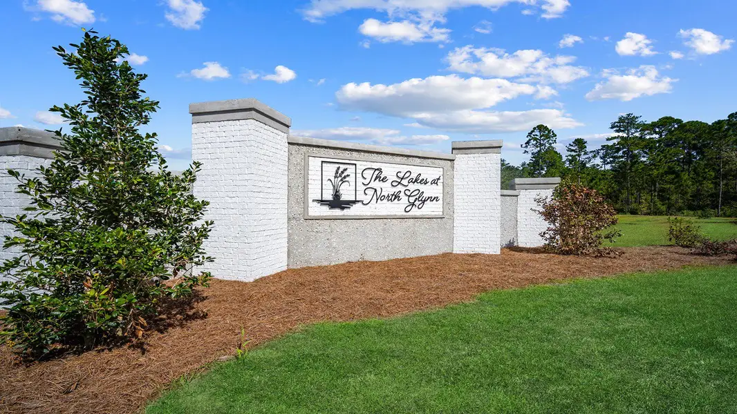 Entrance to the The Lakes at North Glynn community in Brunswick, GA, featuring signage and landscaping (Image 1).