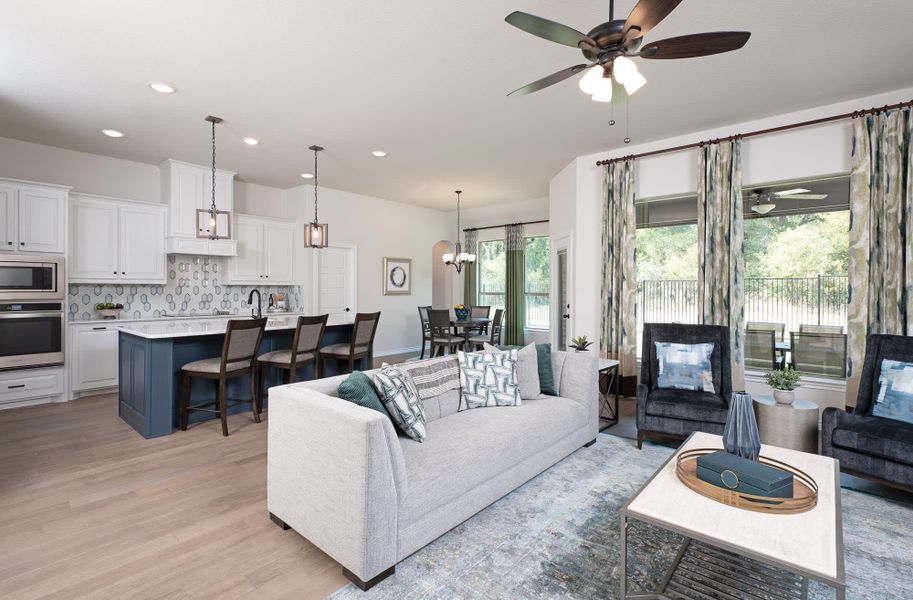 Family Room & Kitchen | Concept 2464 at Coyote Crossing in Godley, TX by Landsea Homes