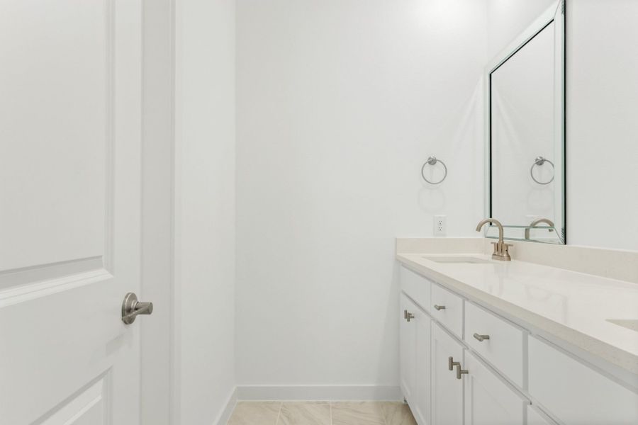 Furnished interior in a model home at Windsong Ranch Townhomes in Prosper (Image 42).