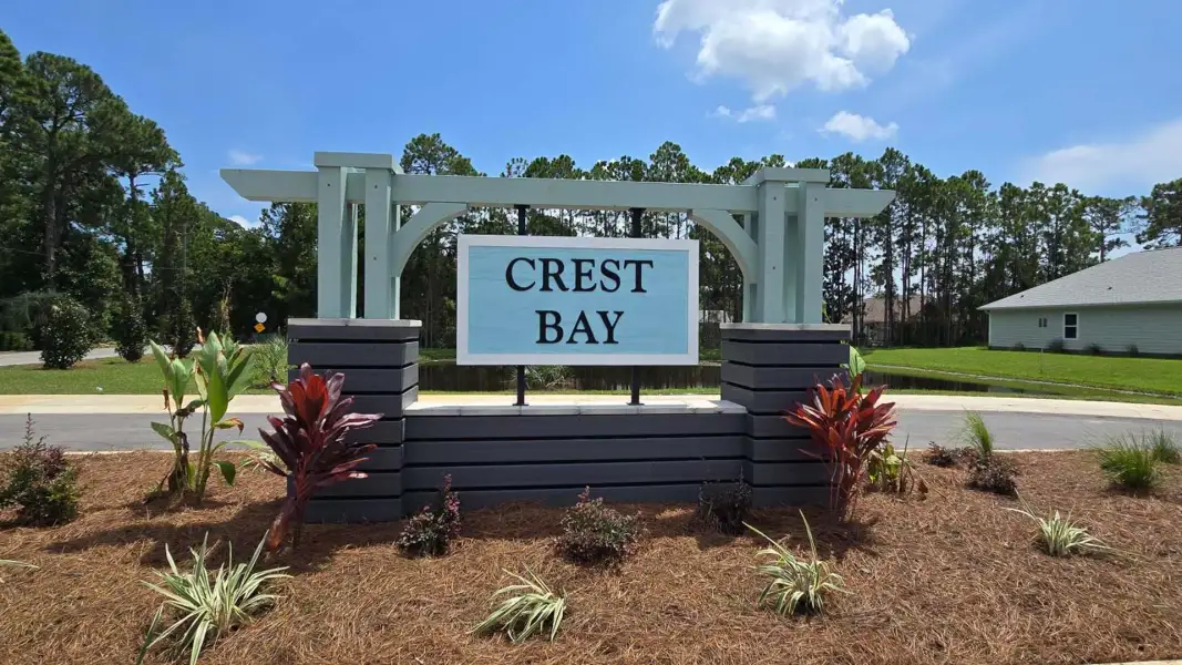 Entrance to the Crest Bay Cottages community in Miramar Beach, FL, featuring signage and landscaping (Image 2). Entrance to the Crest Bay Cottages community in Miramar Beach, FL, featuring signage and landscaping (Image 2).