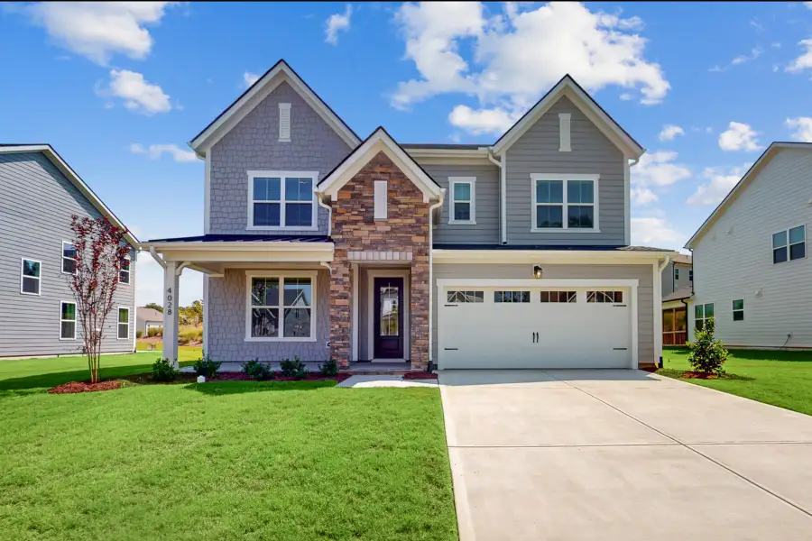 Front exterior of a home in the Friendship Village: Friendship Village Single-Family community, located in Apex, NC (Image 3).