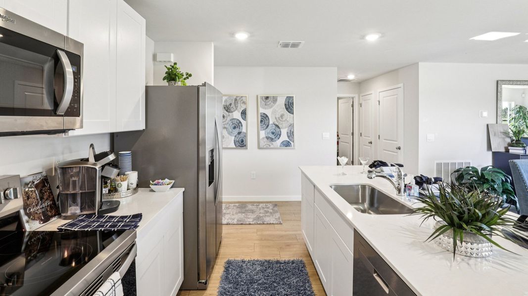 Furnished interior in a model home at Asher Park in Lehigh Acres (Image 26).