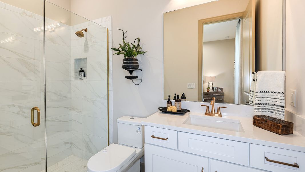 Furnished interior in a model home at Esplanade by the Islands in Naples (Image 74).