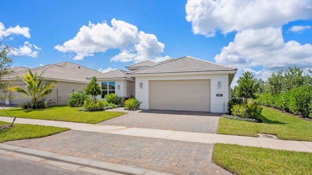 Front exterior of a home in the BELTERRA community, located in Port St. Lucie, FL (Image 64).