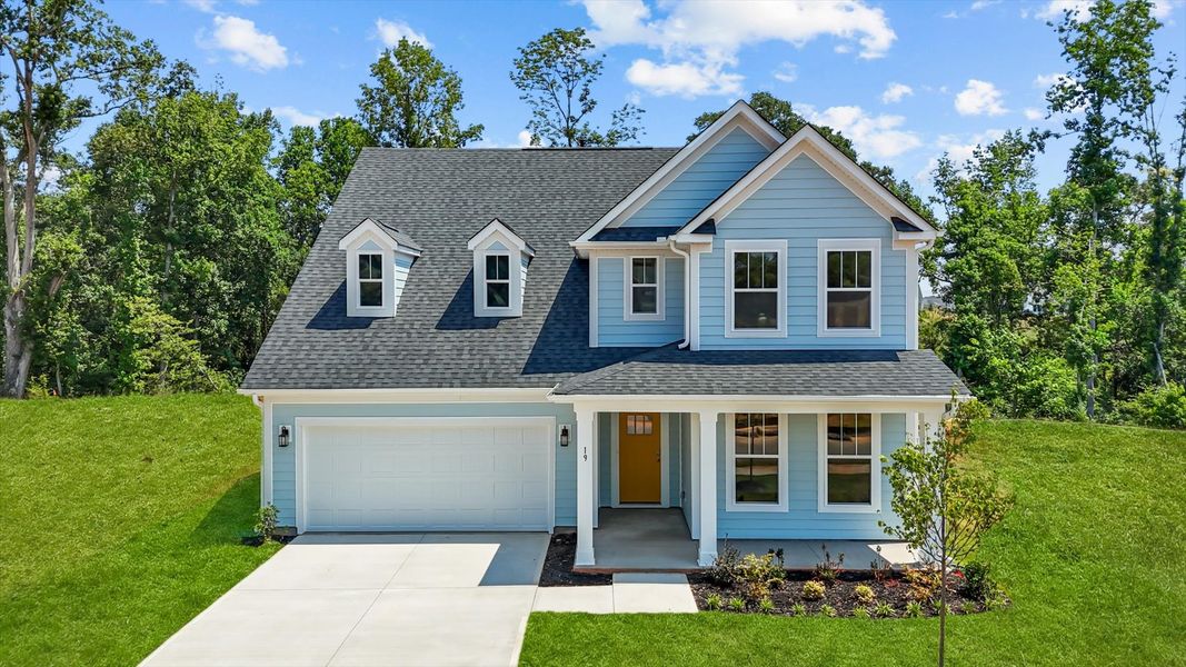 Stunning light gray exterior two story home with two car garage and large windows at Pelham Crossing by DRB Homes
