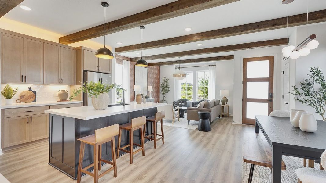 Bask in warmth with exposed wood beams and modern interiors in Spring Creek's upscale community.