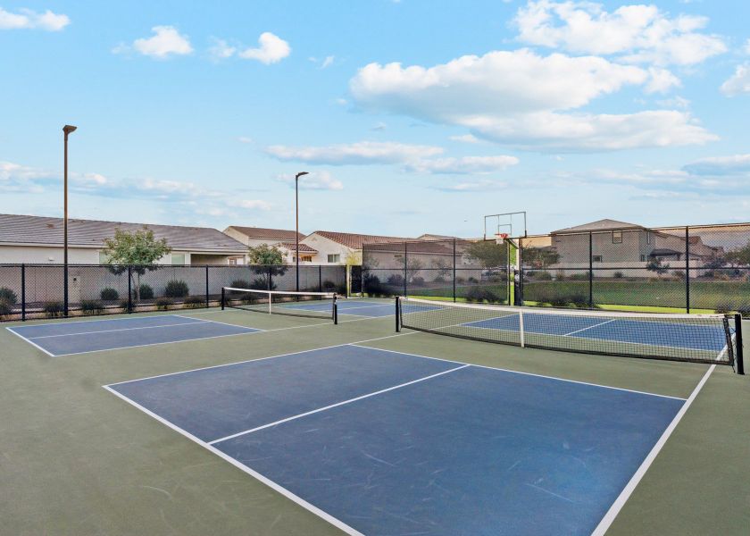A tennis court with a net. A tennis court with a net.