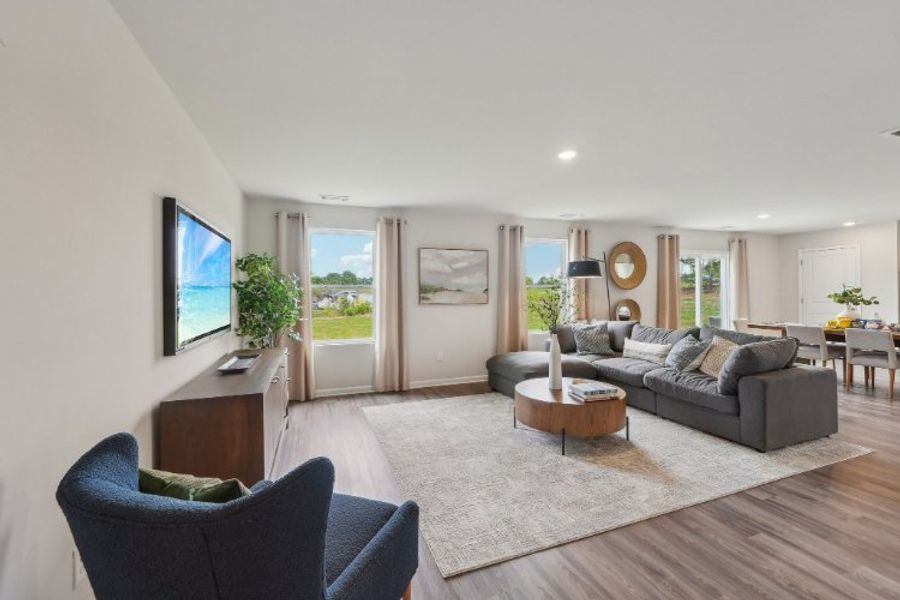 A living room with a tv and couches.