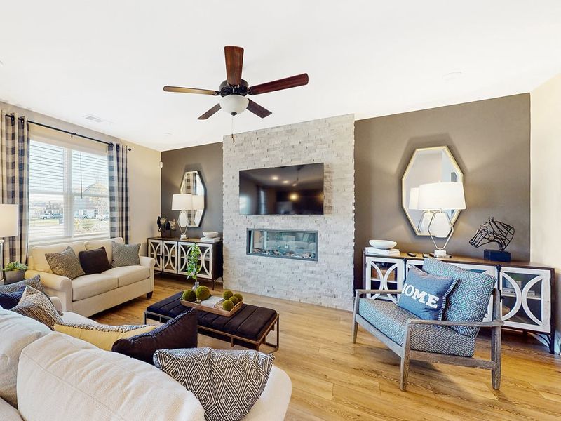 A living room with a fireplace. A living room with a fireplace.