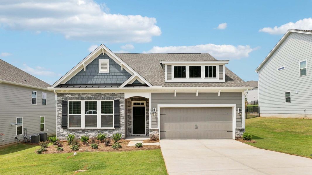 Front exterior of a home in the Reserve at Tap Root Farms community, located in Fletcher, NC (Image 1).