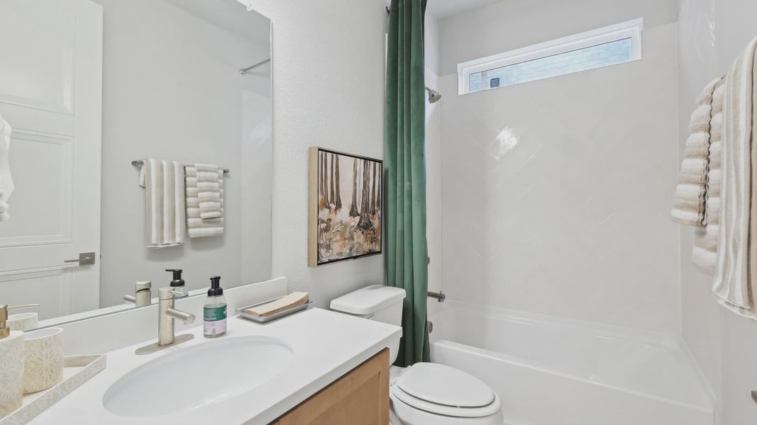 Experience luxury with herringbone tiles and sleek vanity in Wildflower Ranch. Indulge in top-tier design. Experience luxury with herringbone tiles and sleek vanity in Wildflower Ranch. Indulge in top-tier design.