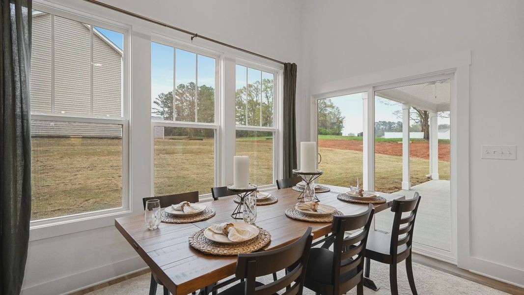 Optional extended breakfast area adorned with windows and sliding door at Pinebrook by DRB Homes in Woodruff, SC Optional extended breakfast area adorned with windows and sliding door at Pinebrook by DRB Homes in Woodruff, SC