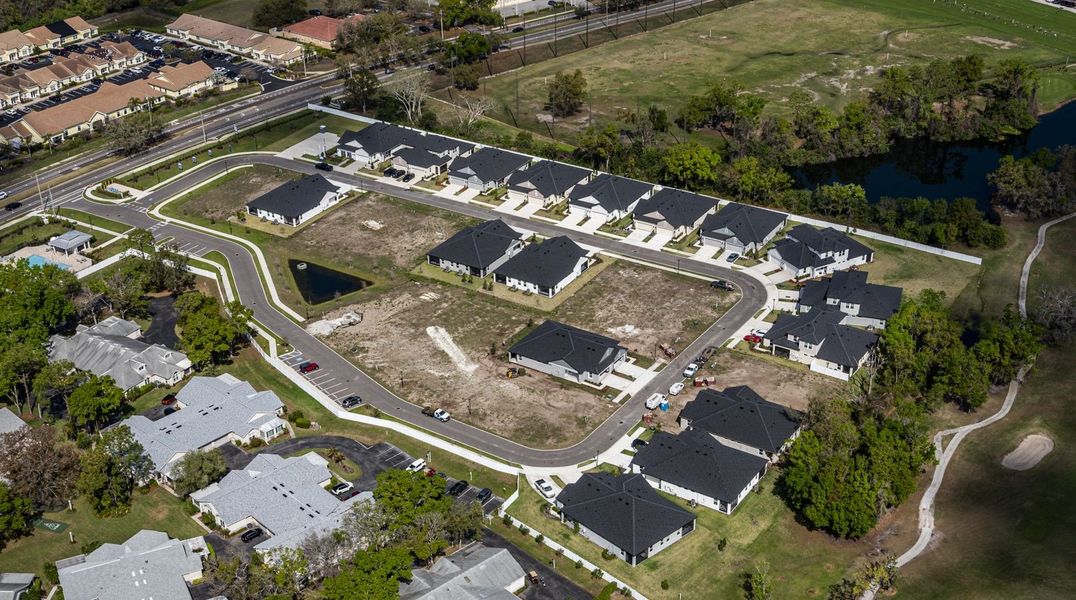 Aerial view of the Fairway Pointe - 55+ Villa Community community in Sun City Center, FL, showing layout and nearby surroundings (Image 1). Aerial view of the Fairway Pointe - 55+ Villa Community community in Sun City Center, FL, showing layout and nearby surroundings (Image 1).