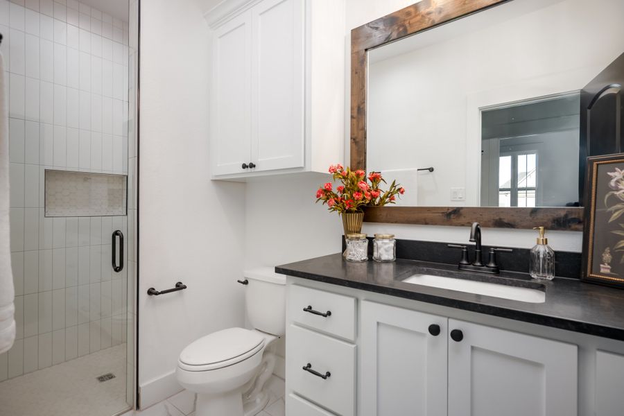 Furnished interior in a model home at Greens Prairie Reserve in College Station (Image 19).