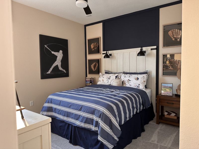 A sophisticated bedroom featuring stylish decor in Crossroads at Kelly Park by Dream Finders Homes (Apopka, FL).