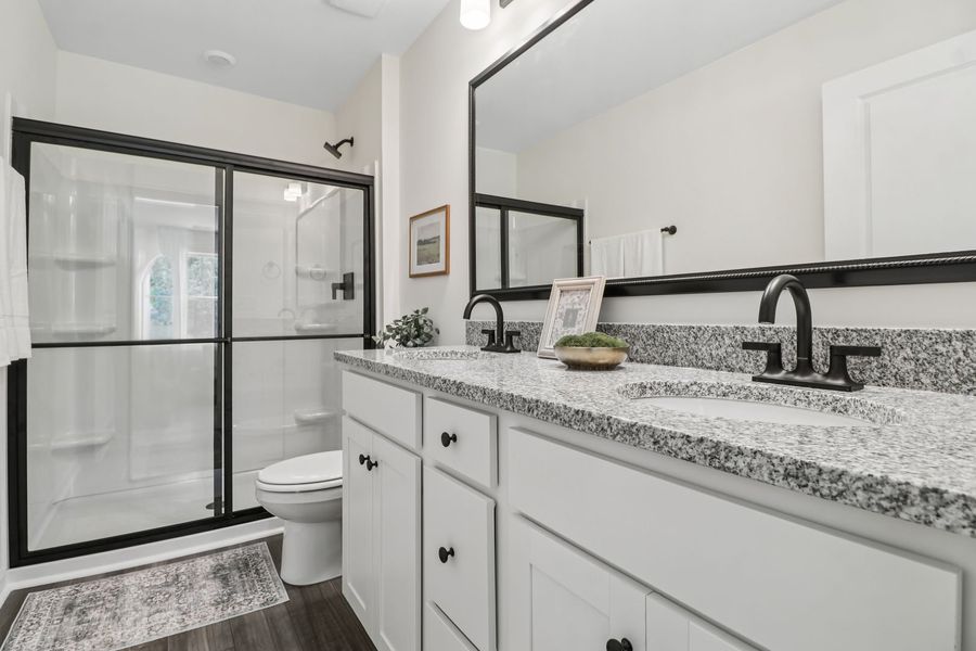 A stylish primary bath that blends comfort and functionality