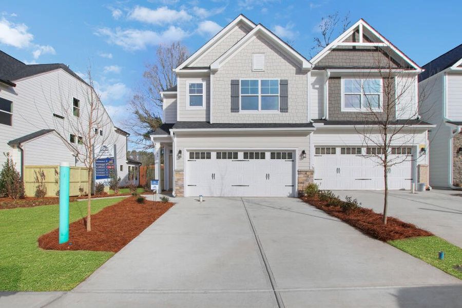 Front exterior of a home in the Villas at Dawsonville Townhomes community, located in Dawsonville, GA (Image 3). Front exterior of a home in the Villas at Dawsonville Townhomes community, located in Dawsonville, GA (Image 3).