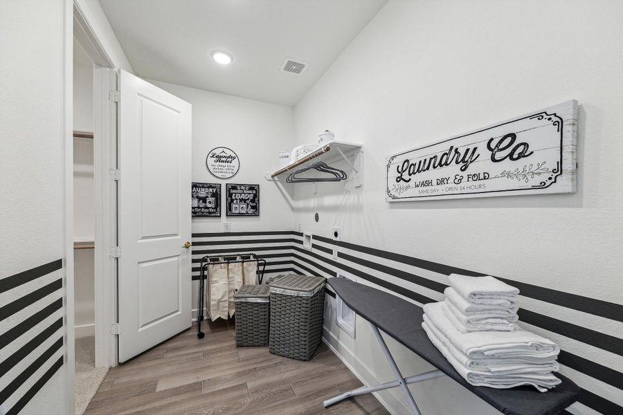 Furnished interior in a model home at The Woodlands Hills – 55' in Willis (Image 17).