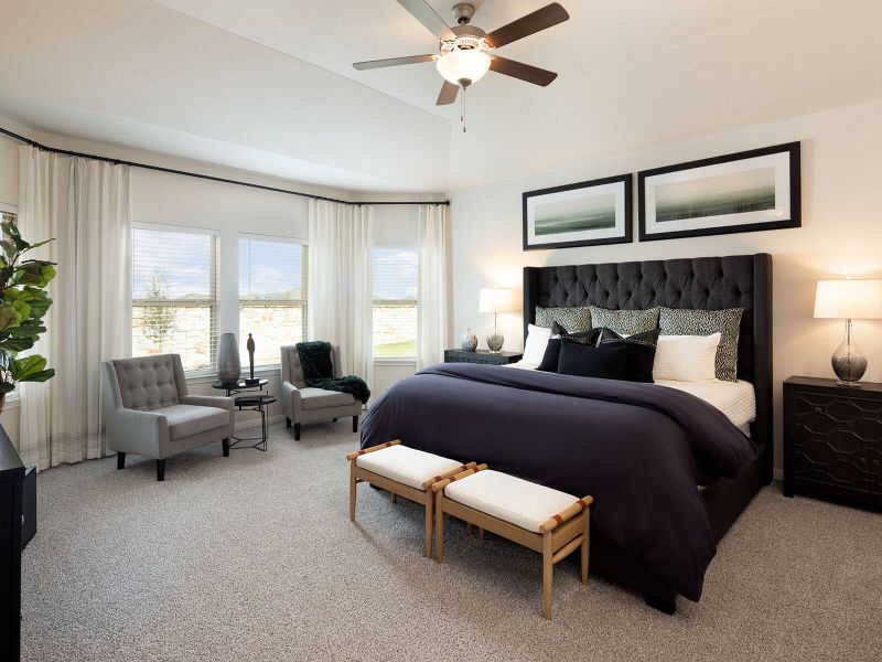 The bay window provides lots of natural lighting in the primary bedroom.