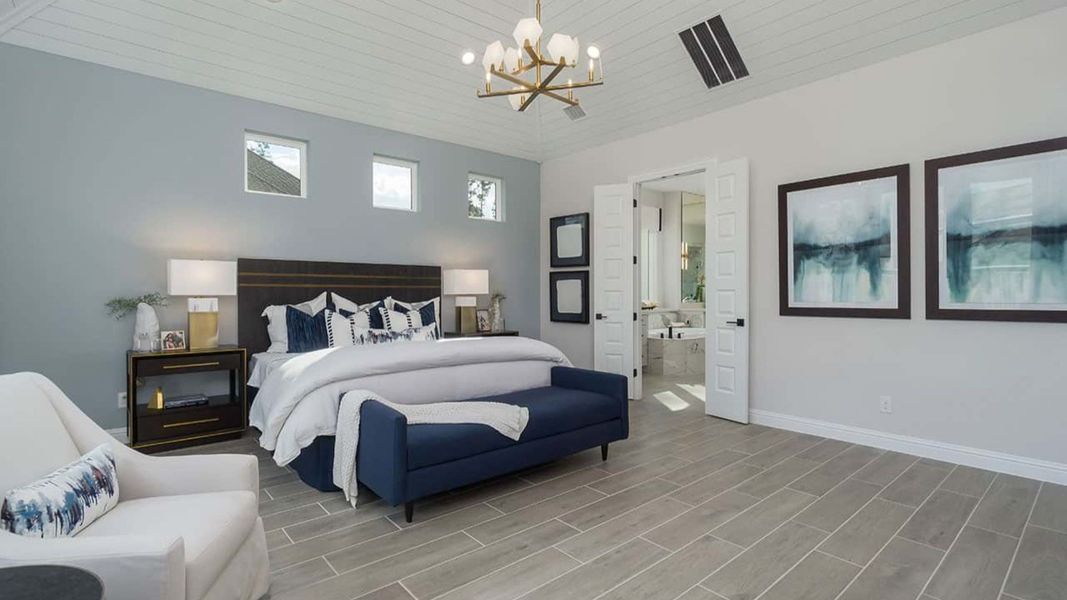 Experience opulence with vaulted ceilings and refined finishes in Mostyn Manor Reserve's exquisite bedroom.