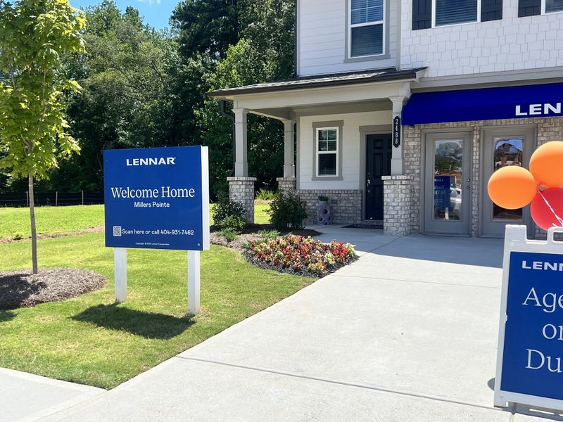 A welcoming home with a landscaped yard in Millers Pointe by Lennar (Conyers, GA).