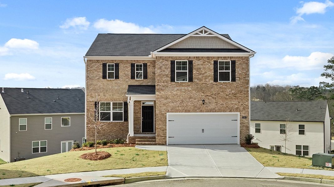Front exterior of a home in the Brooks Village community, located in Dacula, GA (Image 13).