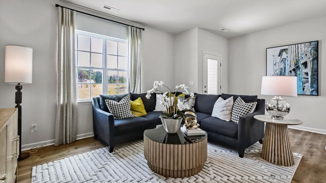 Furnished interior in a model home at The Townes at Prestleigh in Wake Forest (Image 18).