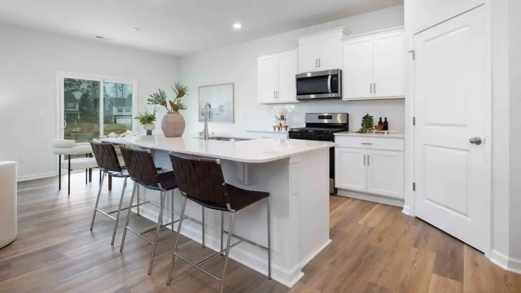 Furnished interior in a model home at Sweetwater Village in Rockwell (Image 5).
