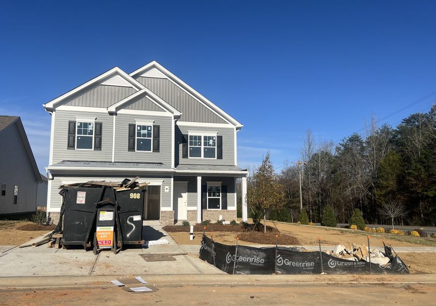 A modern grey home under construction in Orchard Creek by Smith Douglas Homes, Charlotte, NC.