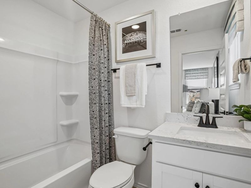 Furnished interior in a model home at Fairway Crossing in Converse (Image 22).