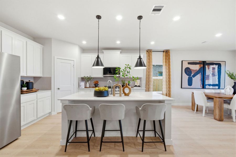 A kitchen with white cabinets. A kitchen with white cabinets.