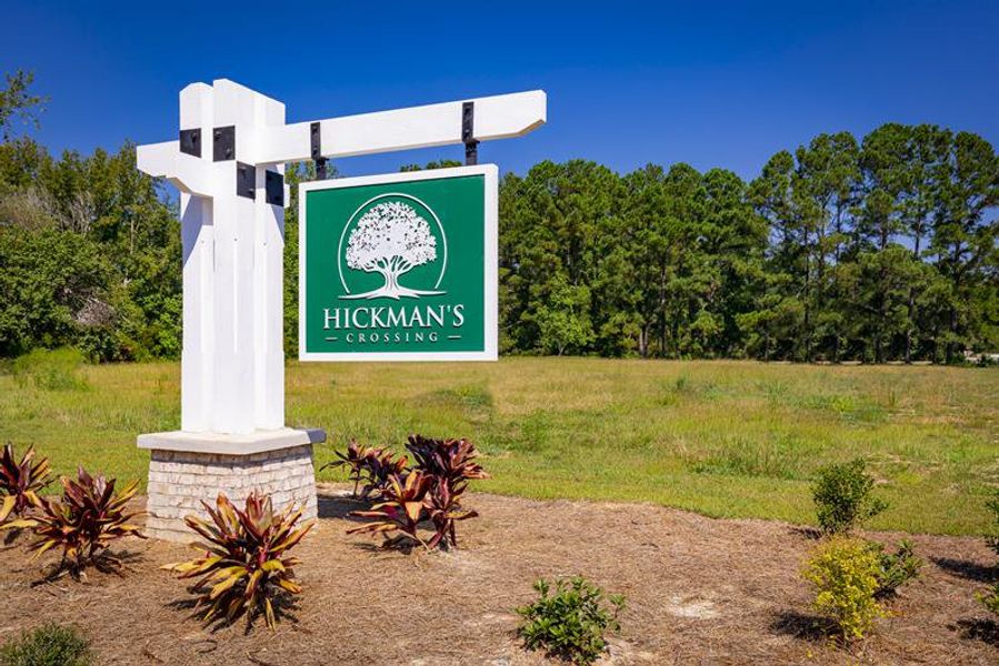 Entrance to the Hickmans Crossing community in Carolina Shores, NC, featuring signage and landscaping (Image 2). Entrance to the Hickmans Crossing community in Carolina Shores, NC, featuring signage and landscaping (Image 2).
