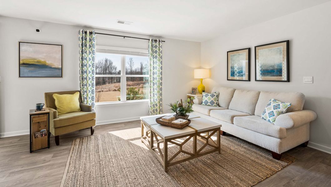 Furnished interior in a model home at Paddock Point in Roebuck (Image 8).