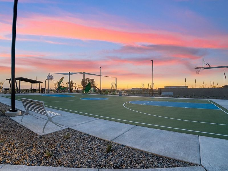 A basketball court with a sunset.