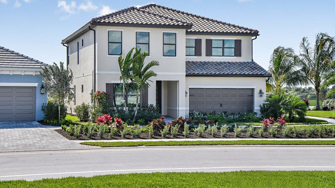 Front exterior of a home in the SkySail Real Estate and Homes for Sale in Naples, FL - Neal Communities community, located in Naples, FL (Image 5).