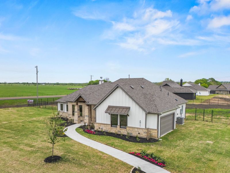 Front exterior of a home in the Carrera Ranch community, located in Waxahachie, TX (Image 5). Front exterior of a home in the Carrera Ranch community, located in Waxahachie, TX (Image 5).