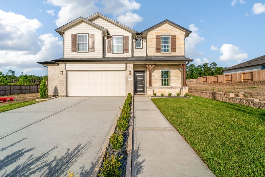 Front exterior of a home in the The Reserve at Huntsville community, located in Huntsville, TX (Image 1).