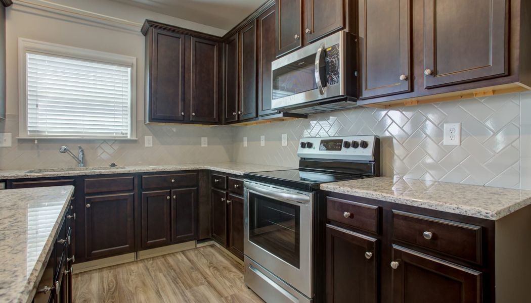 Furnished interior in a model home at North Village in Rydal (Image 22).
