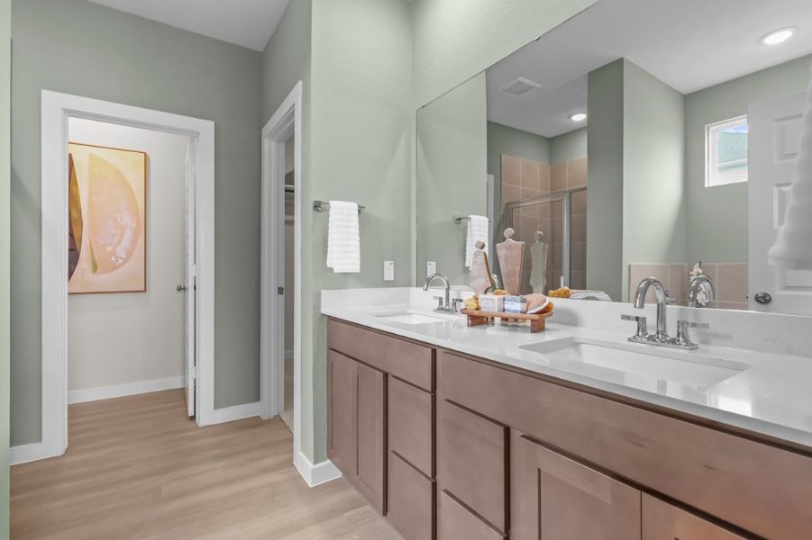 A bathroom with a large mirror. A bathroom with a large mirror.