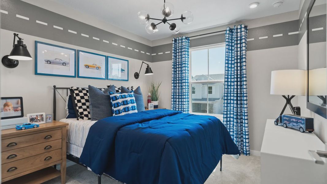 The second bedroom at Cyrene at Harmony by DRB Homes features a large window, bringing in natural light! The second bedroom at Cyrene at Harmony by DRB Homes features a large window, bringing in natural light!