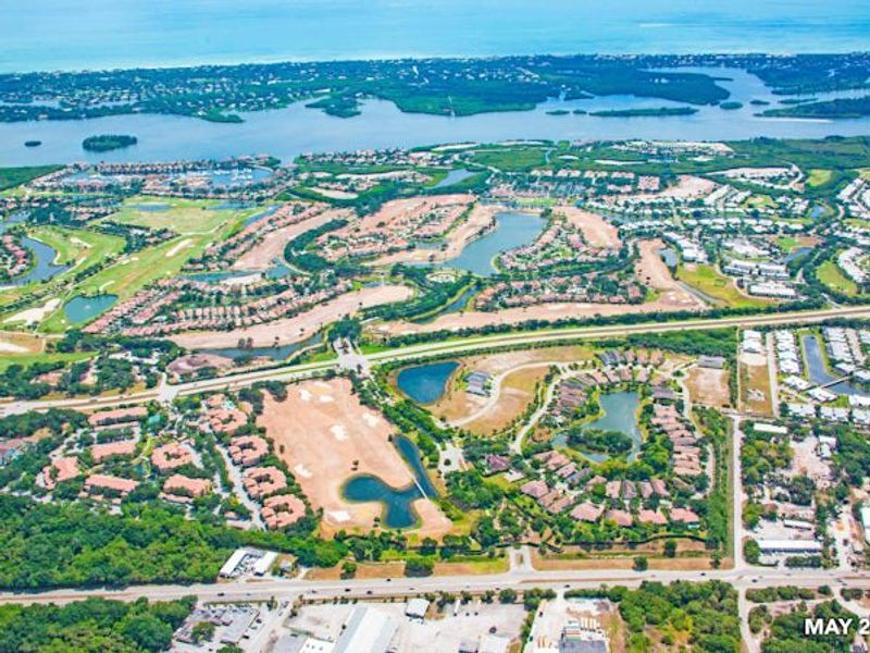 Aerial view of the The Falls at Grand Harbor community in Vero Beach, FL, showing layout and nearby surroundings (Image 26).