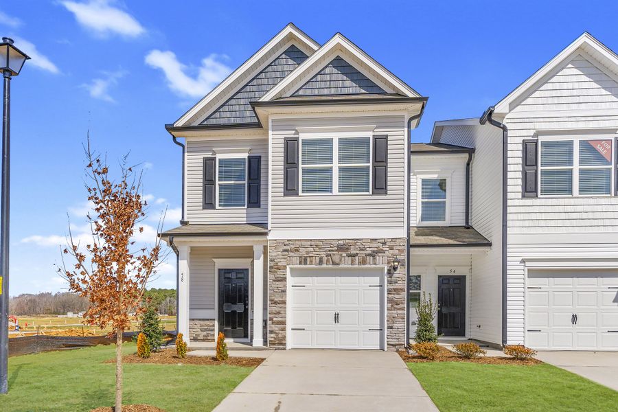 Front exterior of a home in the The Townes at Cape Overlook community, located in Lillington, NC (Image 11). Front exterior of a home in the The Townes at Cape Overlook community, located in Lillington, NC (Image 11).