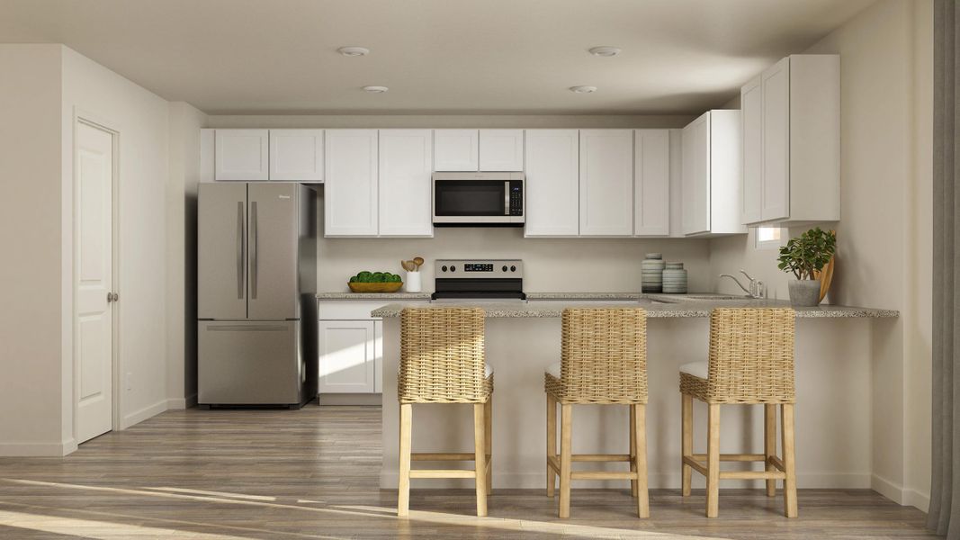 A kitchen with white cabinets.