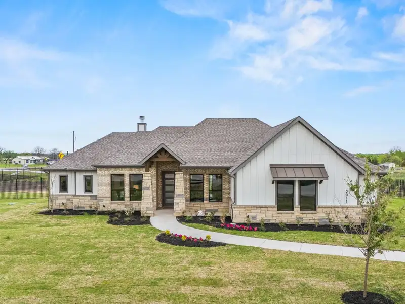 Front exterior of a home in the Carrera Ranch community, located in Waxahachie, TX (Image 11). Front exterior of a home in the Carrera Ranch community, located in Waxahachie, TX (Image 11).