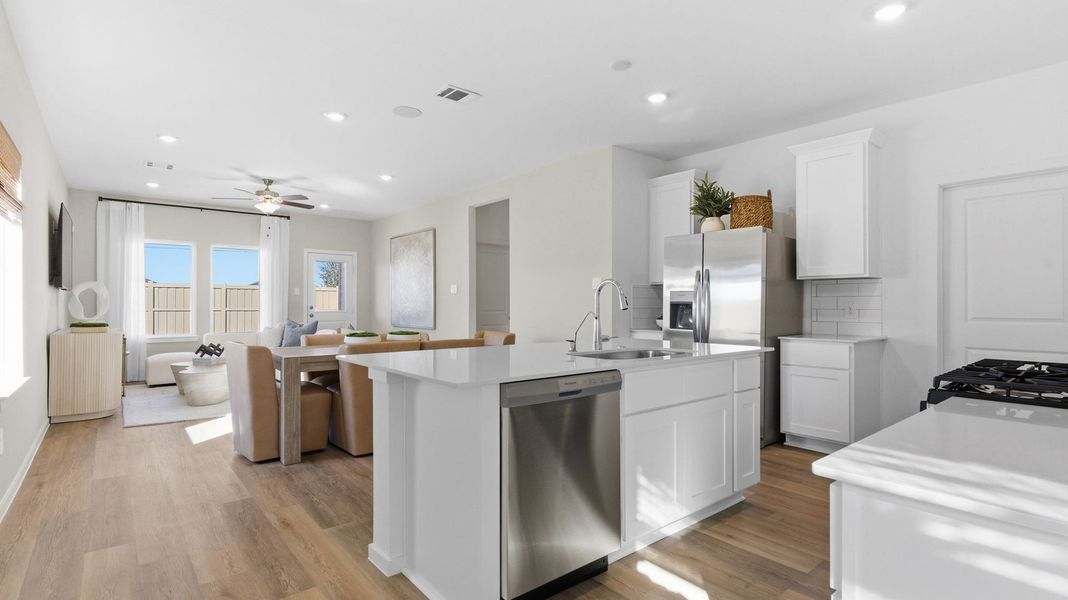 Furnished interior in a model home at Caldwell Crossing in Iowa Colony (Image 7).