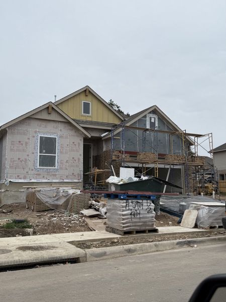 A future charming home under construction in Parkside Peninsula by Highland Homes (Georgetown, TX).