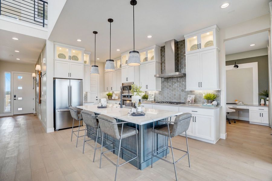 Furnished interior in a model home at Kitchel Lake at Serratoga Falls in Timnath (Image 42).